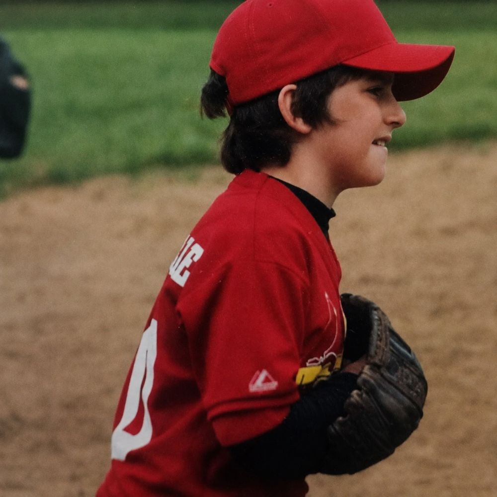 Young chuck playing baseball